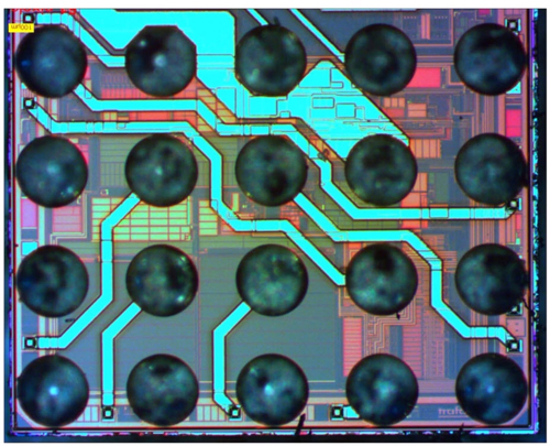 The ASIC, contains millions of circuits on an area of about 2.5 x 2.5 millimeters. The solder points (grey-blue circles in the picture) provide the contact between the chip and the electronics of the pressure transmitter.